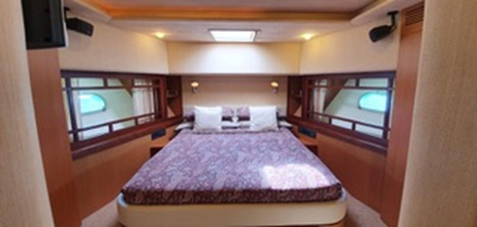a bed in a room aboard SEDROP - 2006 FERRETTI 731 @ PTO. AVENTURAS Yacht for Sale
