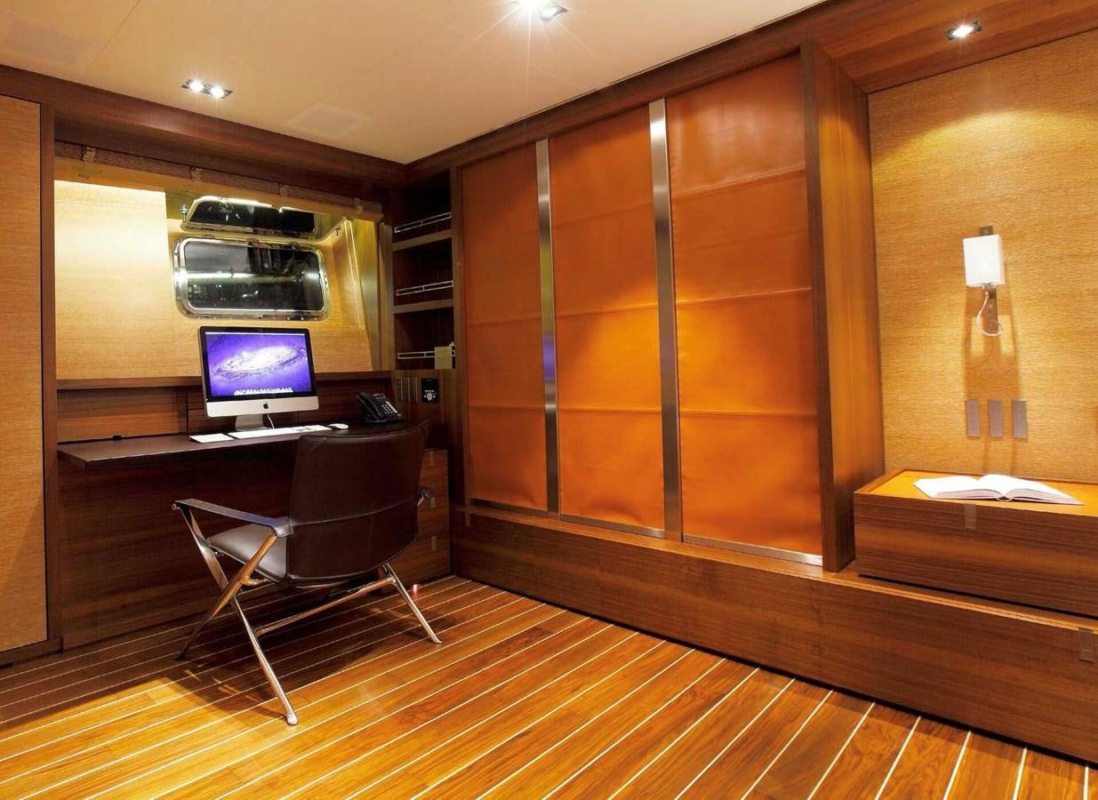a room with a tv and a bed aboard STATE OF GRACE Yacht for Charter