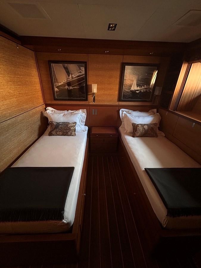 a room with two beds aboard STATE OF GRACE Yacht for Charter