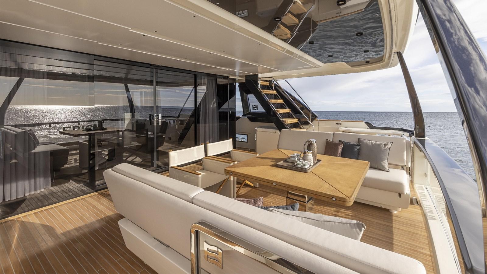 a room with a couch and a table aboard FERRETTI 1000 Yacht for Sale