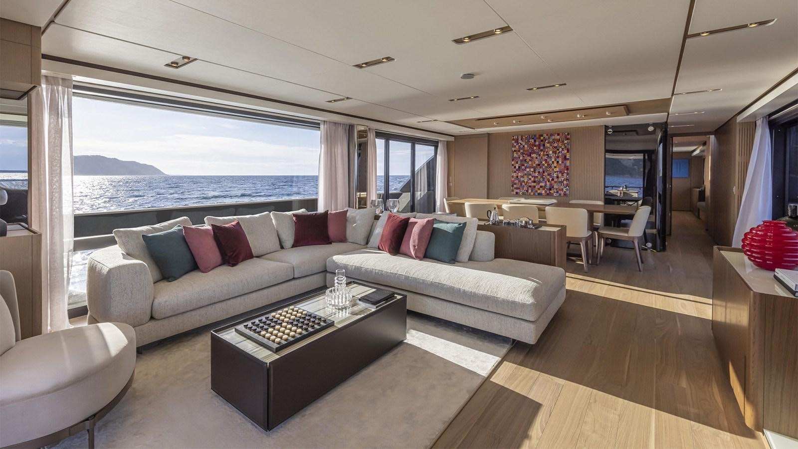 a living room with a large window aboard FERRETTI 1000 Yacht for Sale