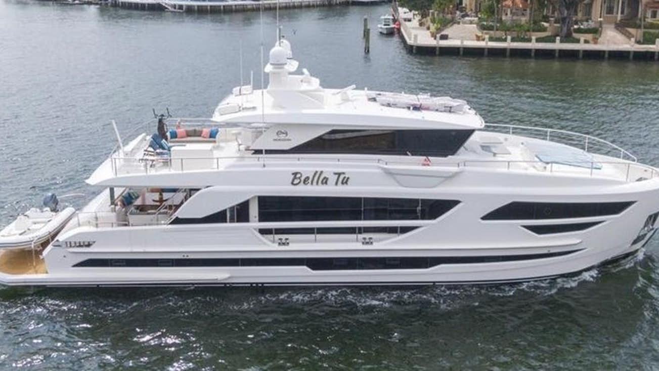 a white yacht on the water aboard BELLA TU Yacht for Sale