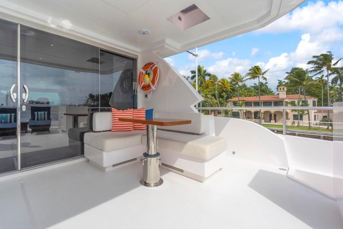 a glass table in a room aboard BELLA TU Yacht for Sale