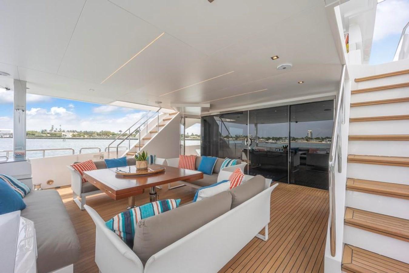 a living room with a wood floor aboard BELLA TU Yacht for Sale
