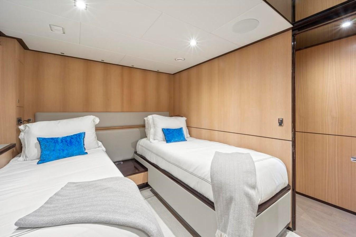 a couple of beds in a room aboard BELLA TU Yacht for Sale
