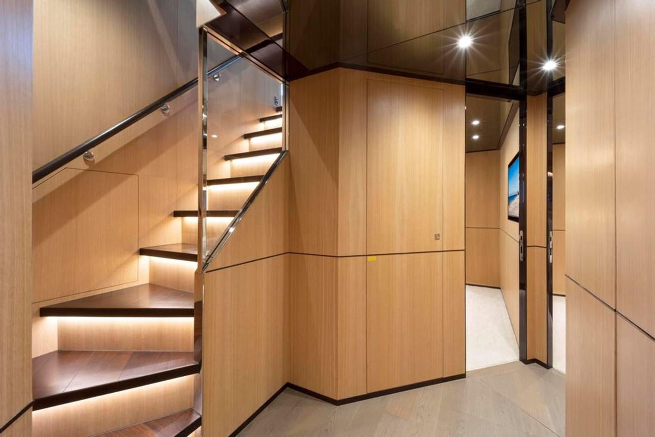 a room with a wood cabinet aboard BELLA TU Yacht for Sale