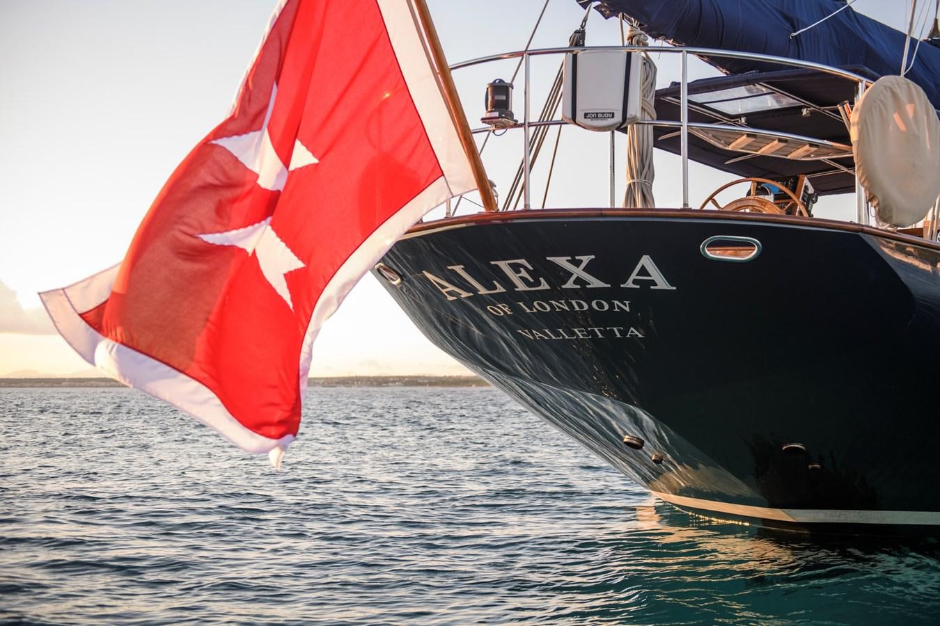 a boat with a flag on it aboard ALEXA OF LONDON Yacht for Sale