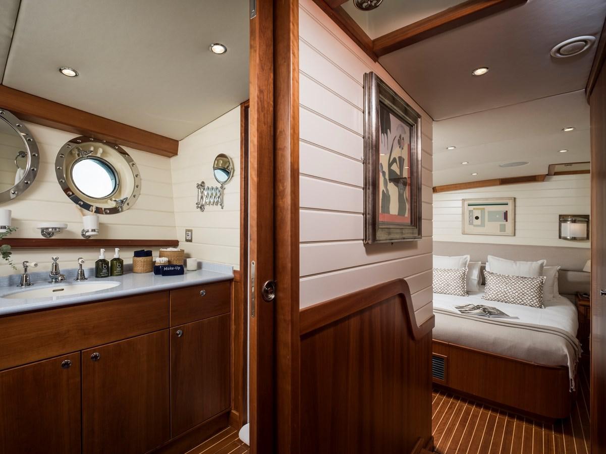 a bathroom with a bed and a sink aboard ALEXA OF LONDON Yacht for Sale
