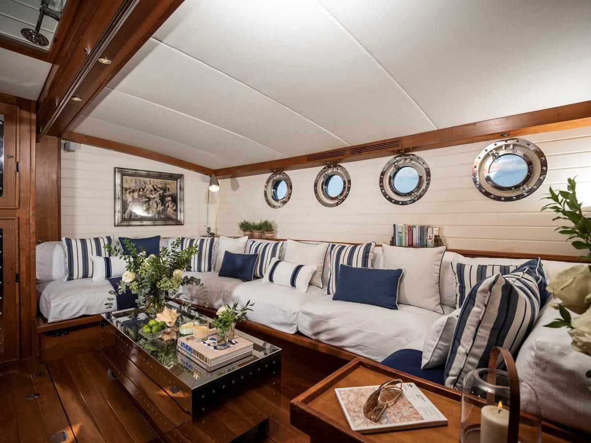 a living room with a couch and a coffee table aboard ALEXA OF LONDON Yacht for Sale
