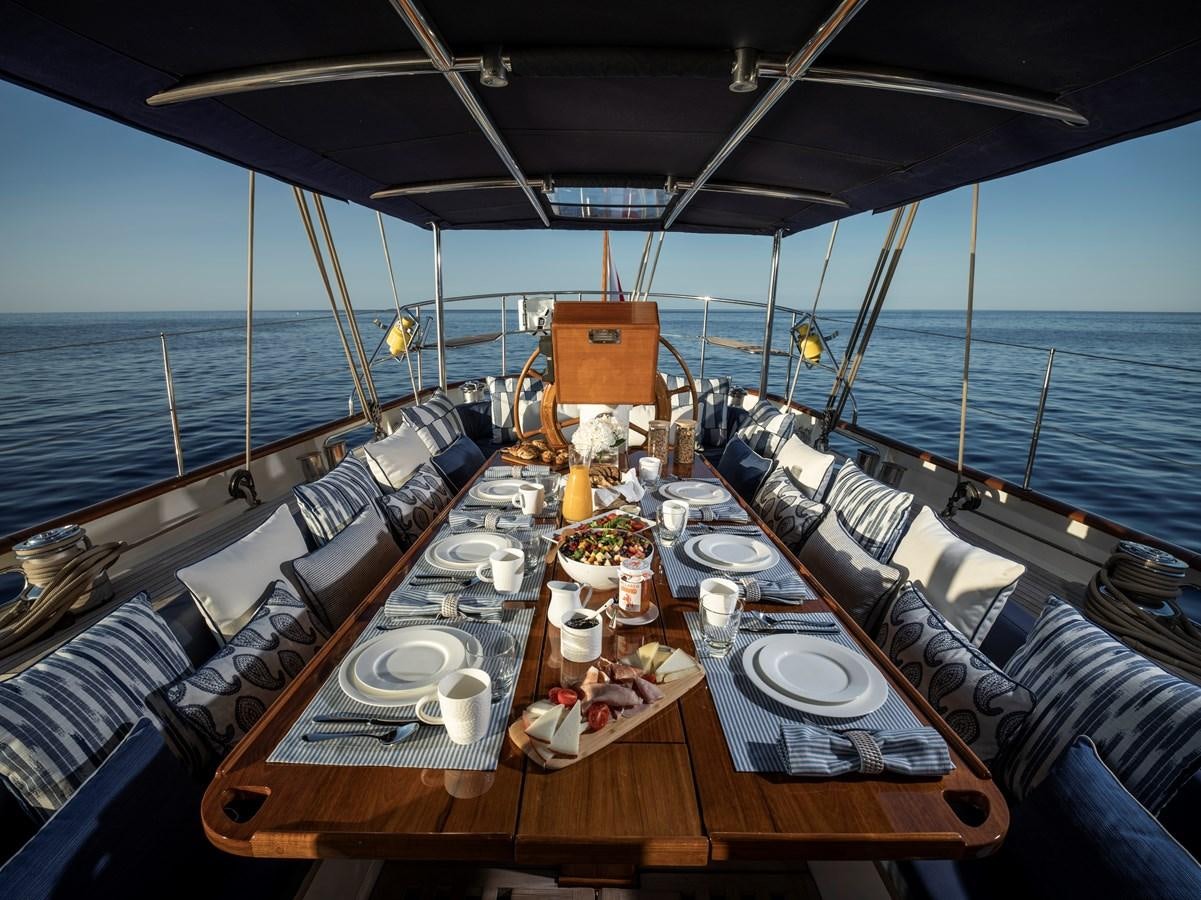a large dining table on a ship aboard ALEXA OF LONDON Yacht for Charter