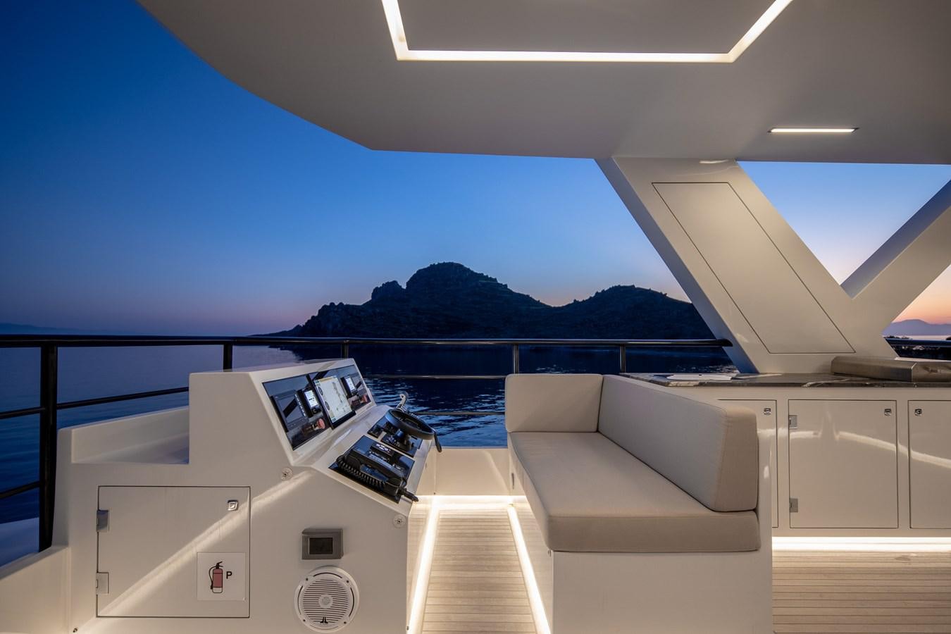 a room with a couch and a large body of water aboard EZGY Yacht for Sale