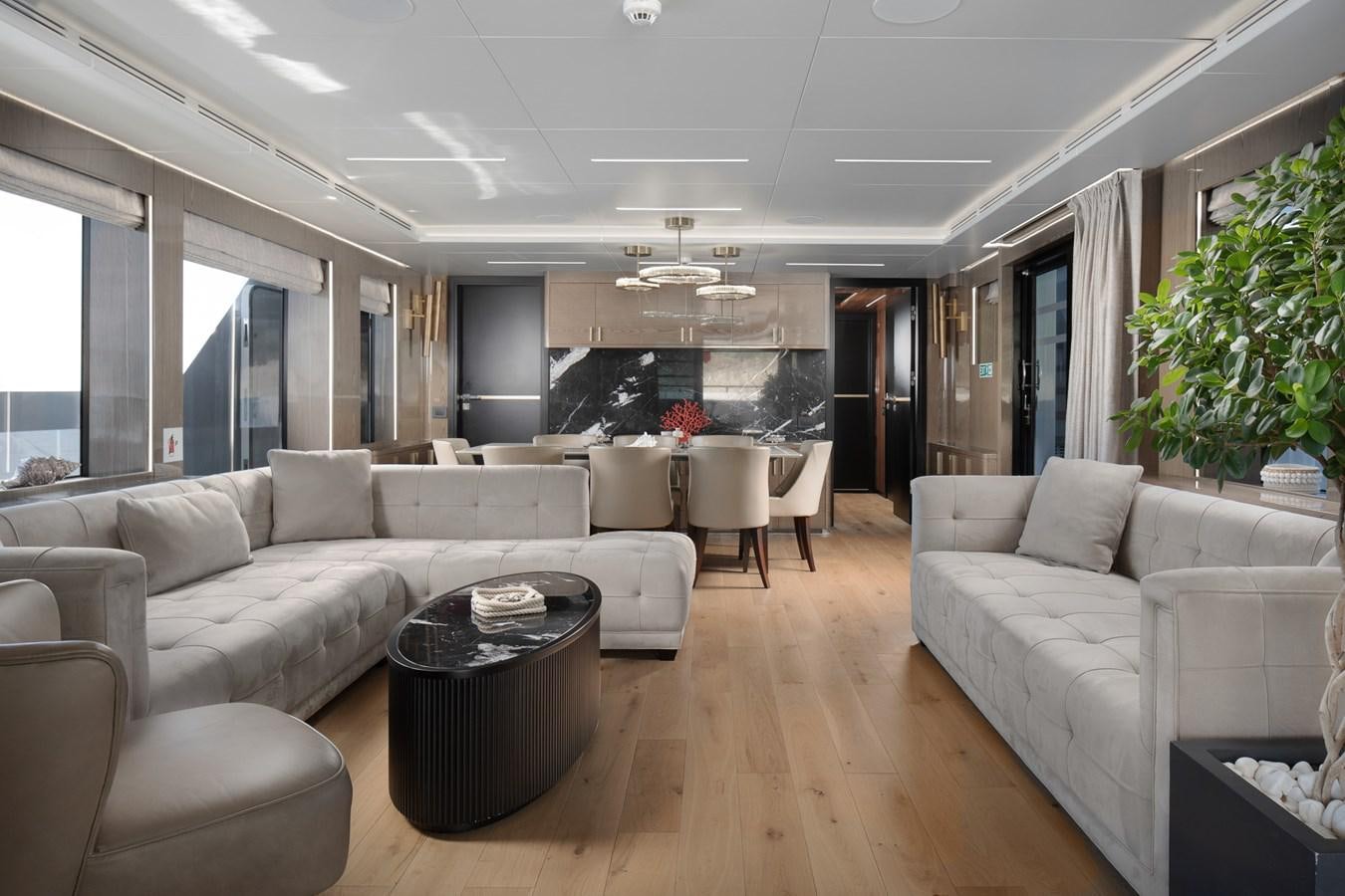 a living room with a couch and a table aboard EZGY Yacht for Sale
