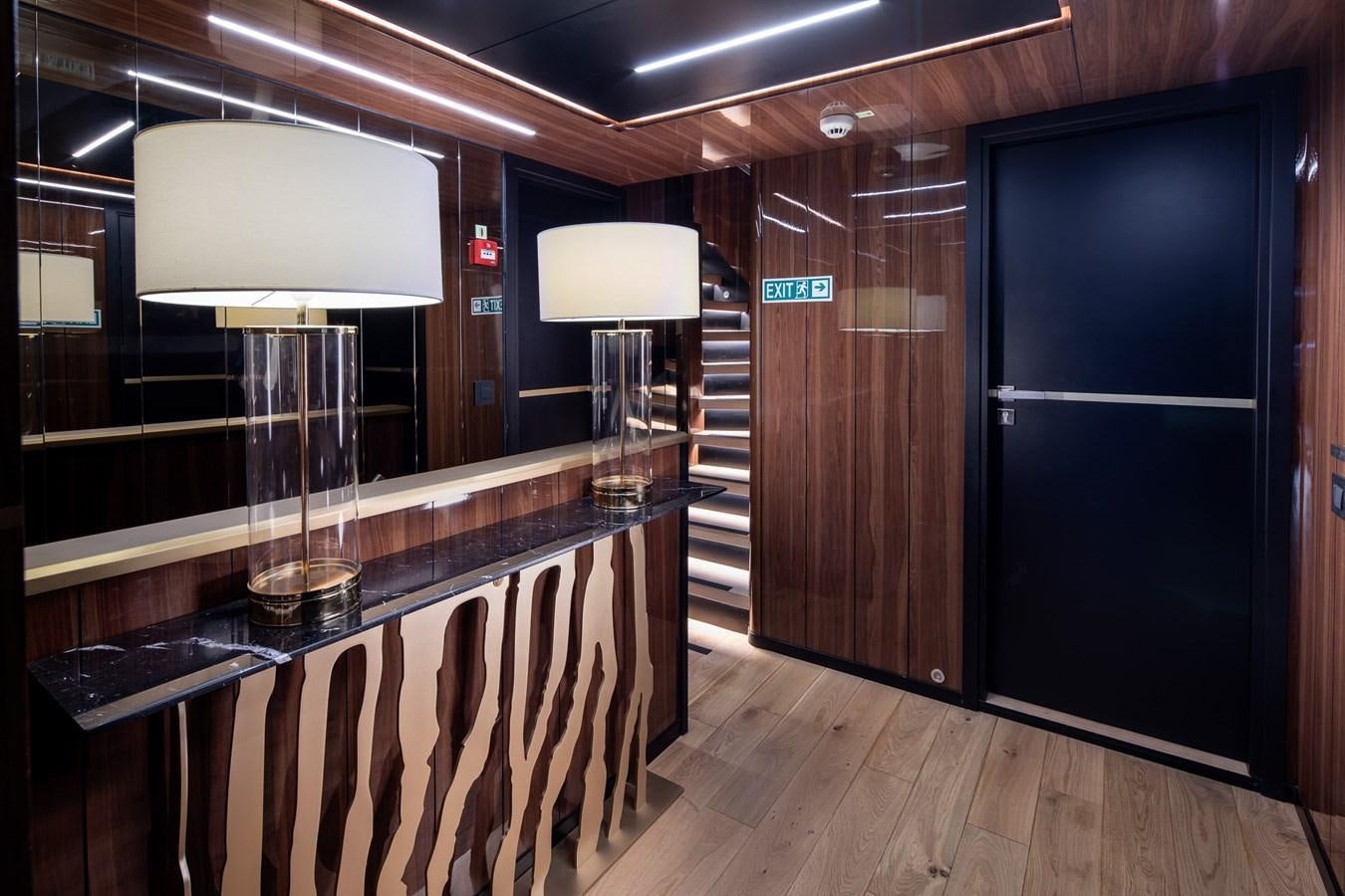 a room with a table and chairs aboard EZGY Yacht for Sale