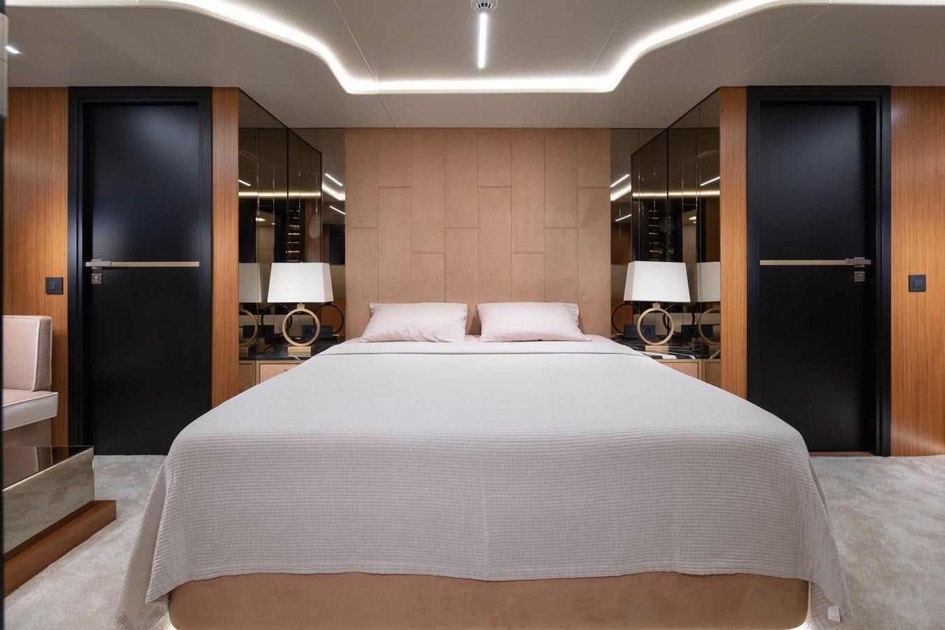 a large bed in a hotel room aboard EZGY Yacht for Sale