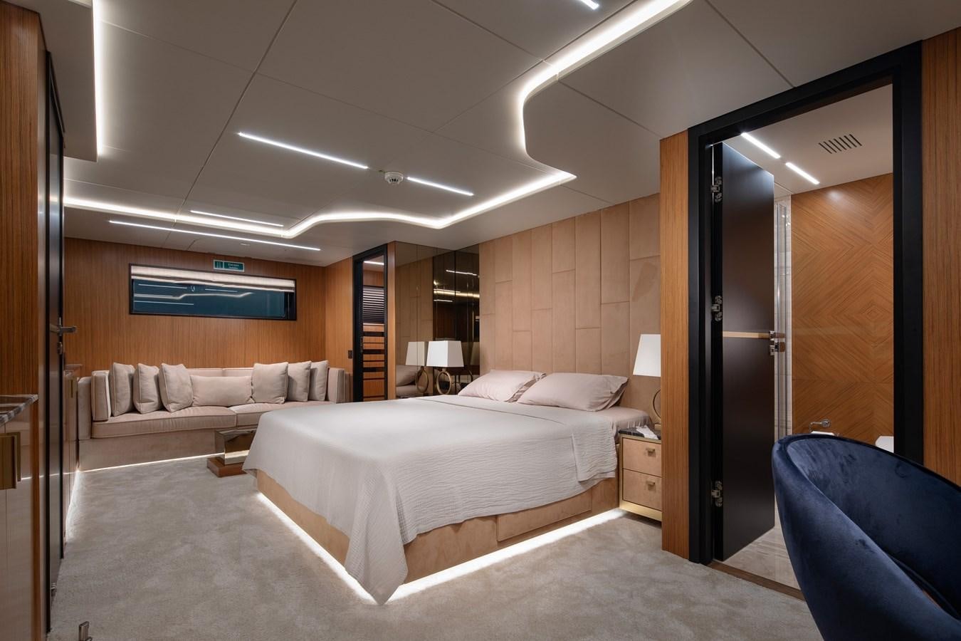 a hotel room with a bed and a couch aboard EZGY Yacht for Sale