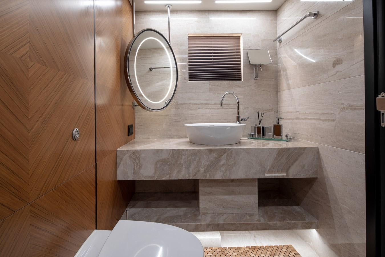 a bathroom with a sink and a mirror aboard EZGY Yacht for Sale