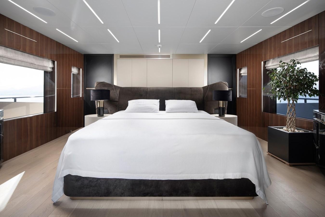 a large bed in a room aboard EZGY Yacht for Sale