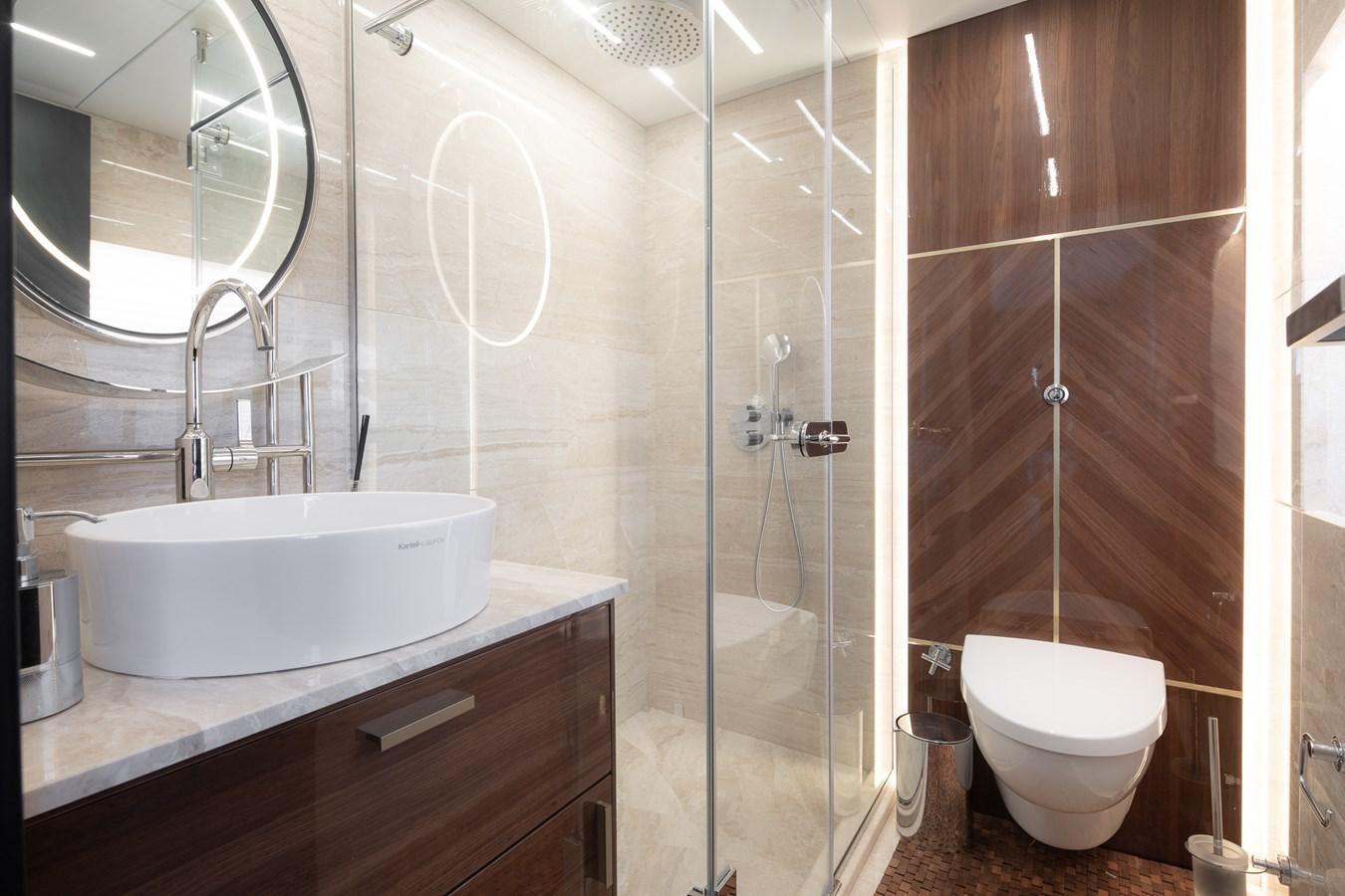 a bathroom with a glass shower aboard EZGY Yacht for Sale