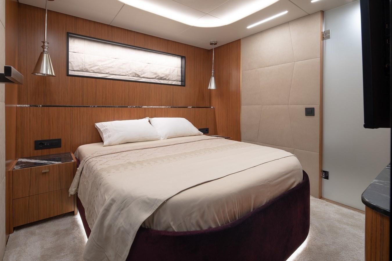 a bed in a room aboard EZGY Yacht for Sale