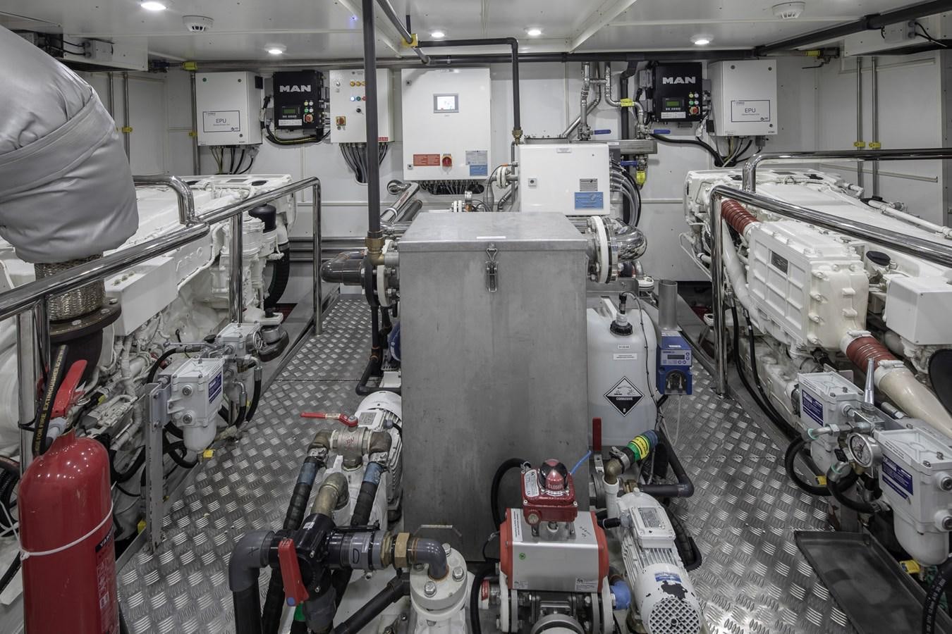 a large machine in a factory aboard EZGY Yacht for Sale