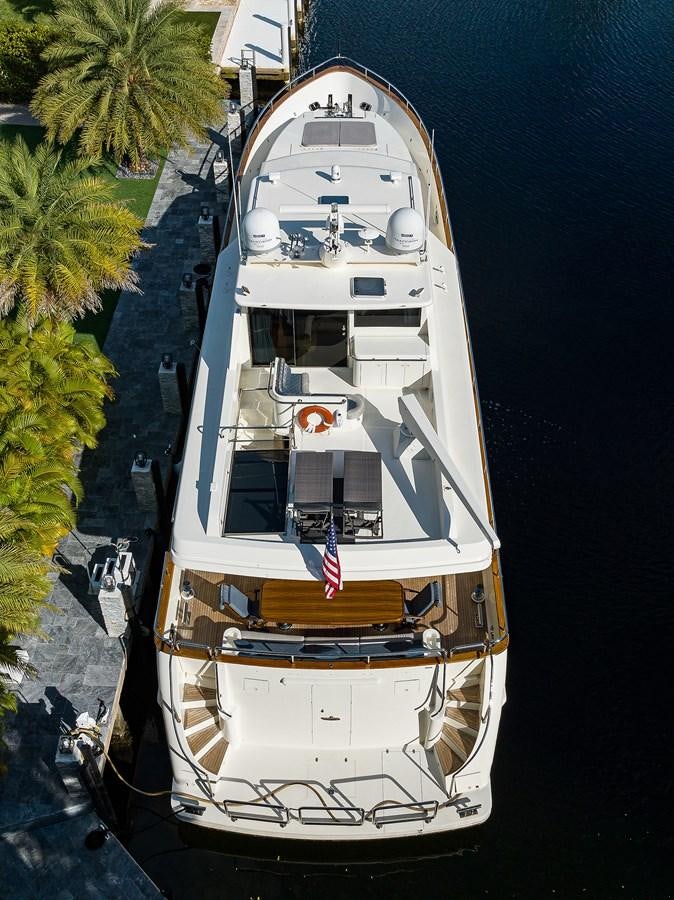 a white boat on water aboard 82 Yacht for Sale