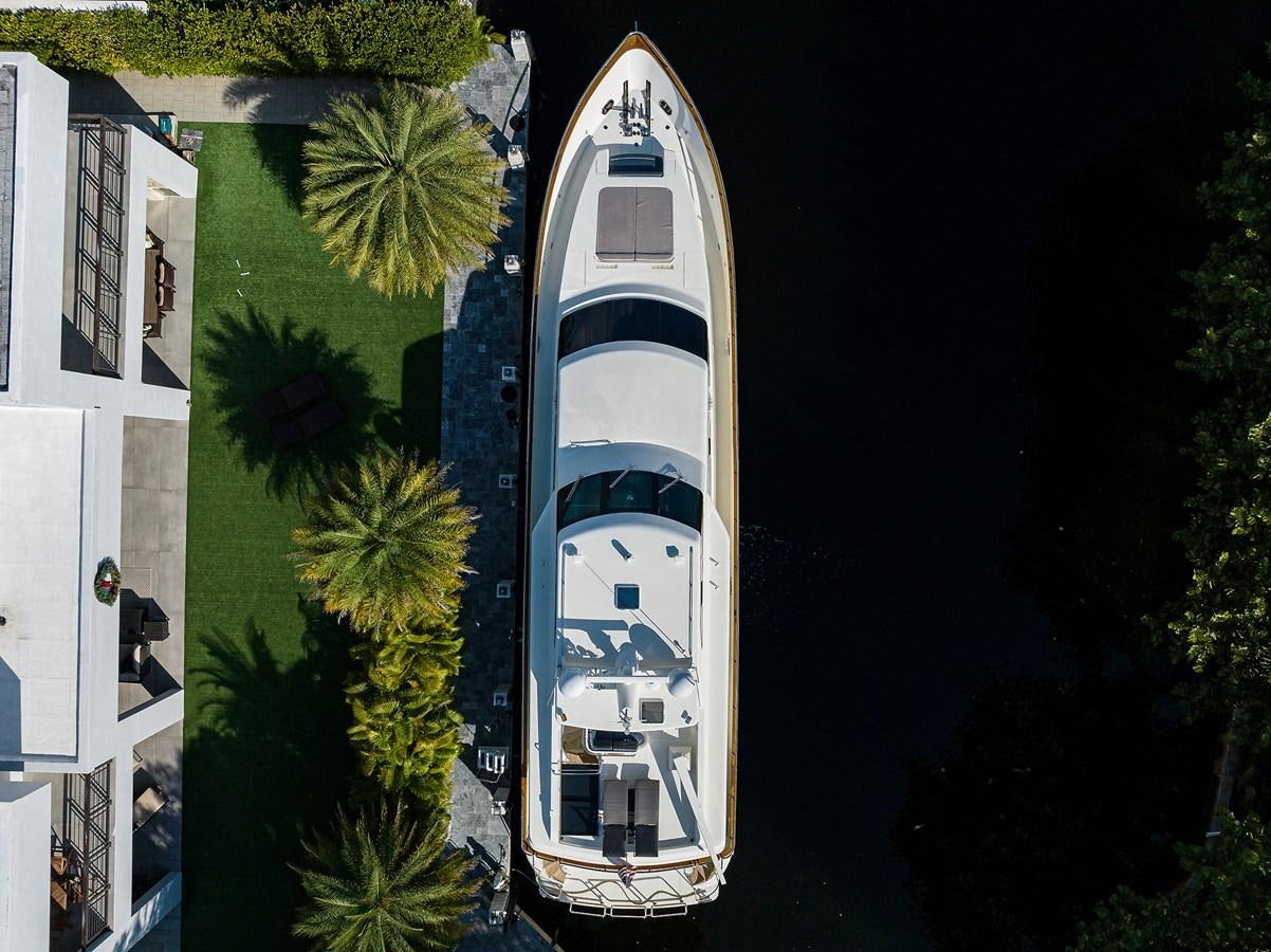 a white boat on a body of water aboard 82 Yacht for Sale
