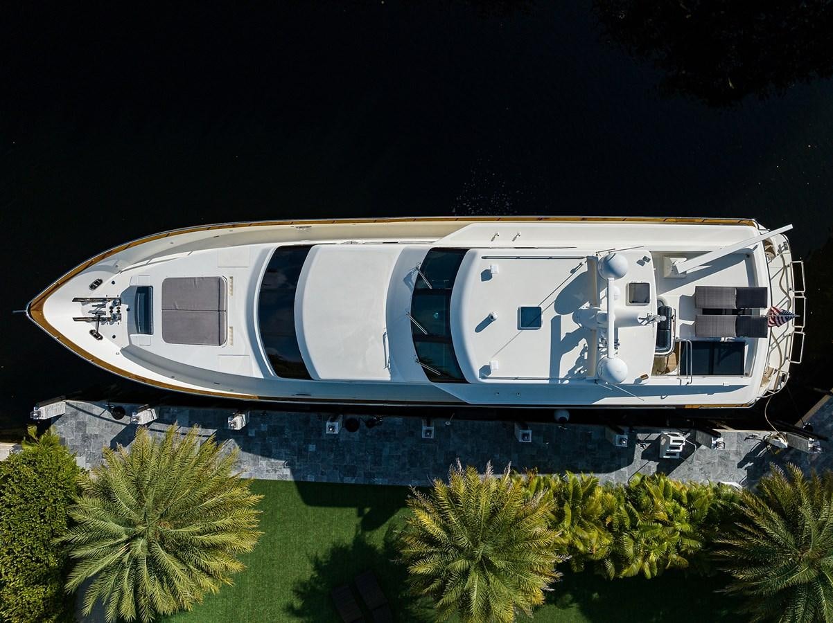 a large white building with a blue sign on it aboard 82 Yacht for Sale