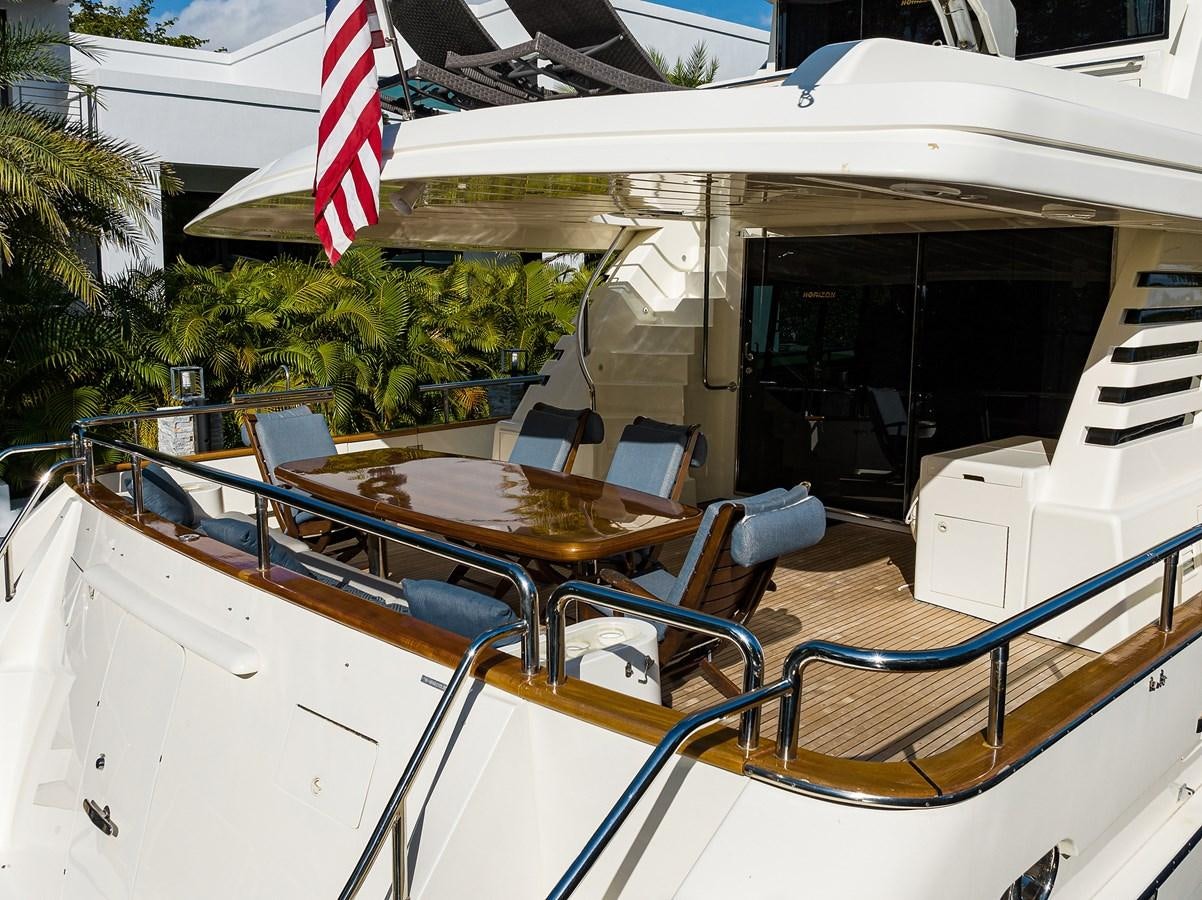 a pool with a flag aboard 82 Yacht for Sale