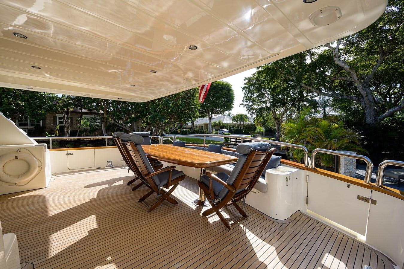 a large room with a table and chairs and a large window aboard 82 Yacht for Sale