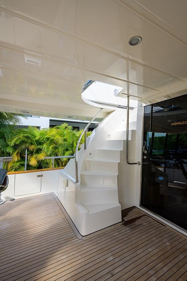 a white staircase in a room aboard 82 Yacht for Sale
