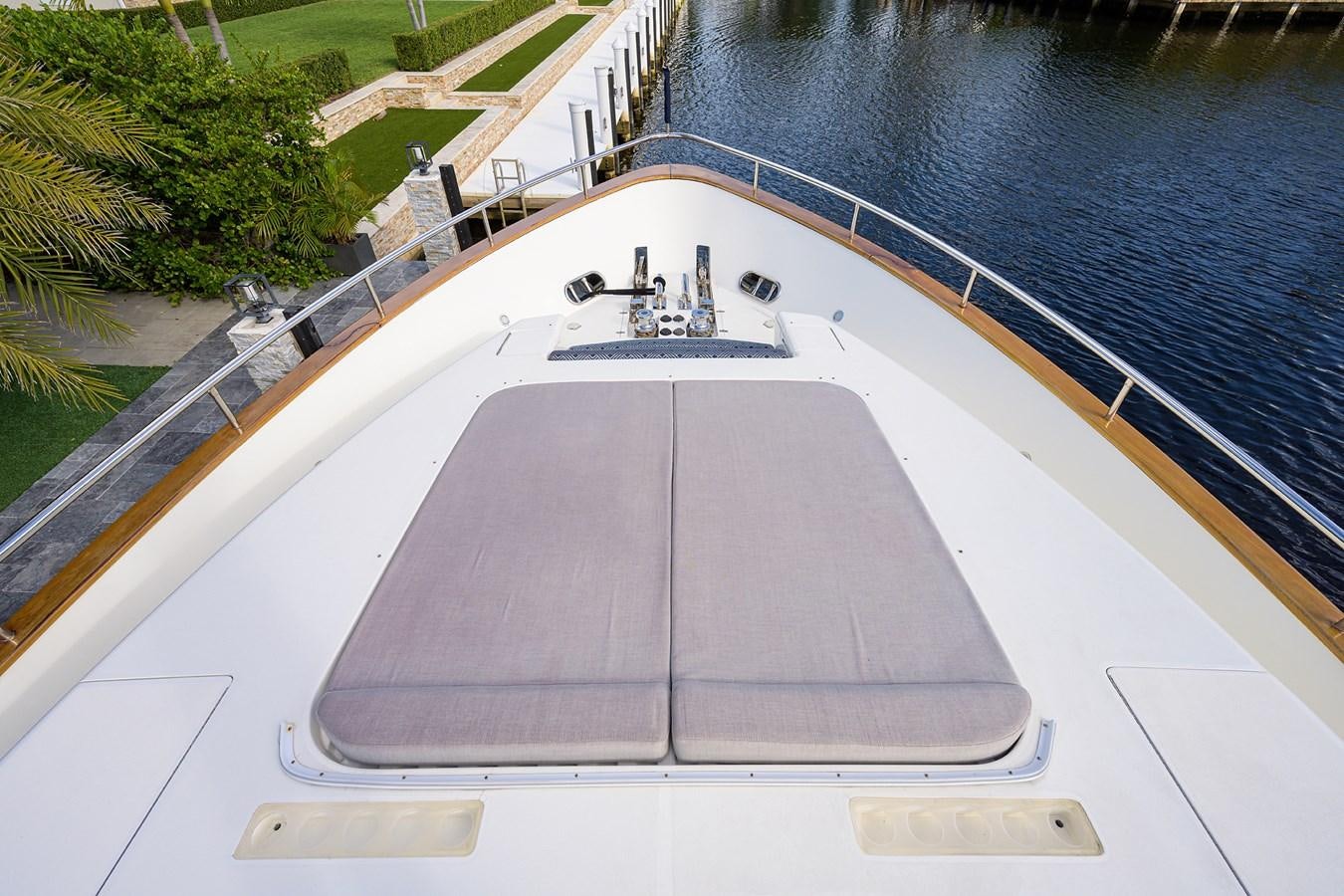 a large white boat with a large flat roof aboard 82 Yacht for Sale