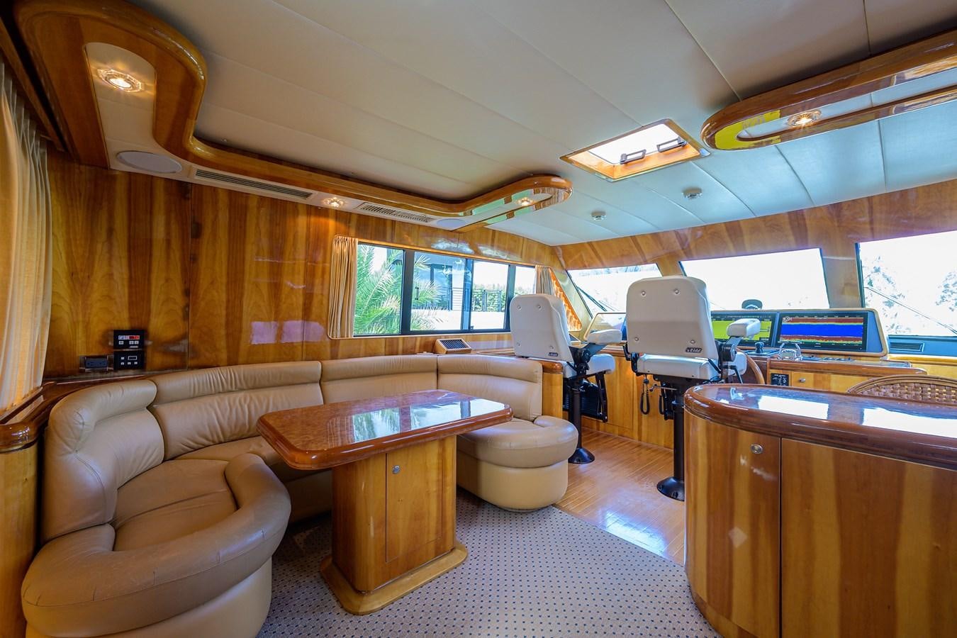 a living room with a couch and a table aboard 82 Yacht for Sale