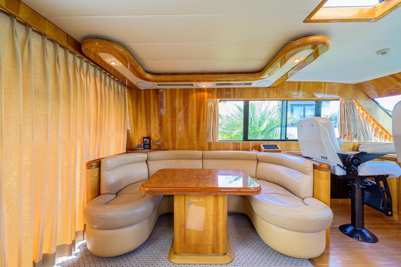 a living room with a couch and a table aboard 82 Yacht for Sale