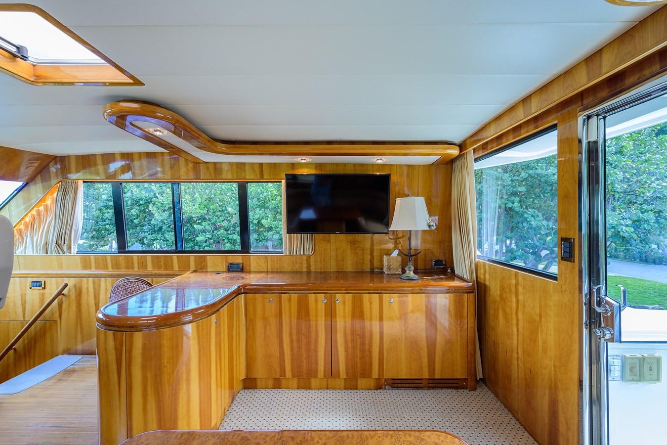 a room with a table and chairs aboard 82 Yacht for Sale