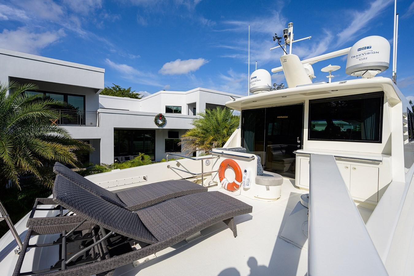 a white building with a solar panel aboard 82 Yacht for Sale