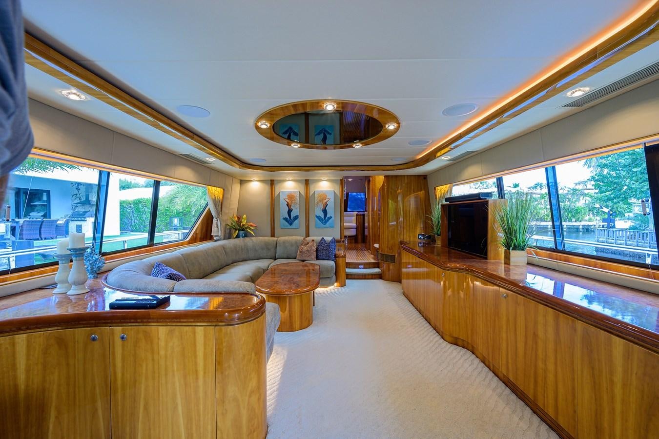 a living room with a large chandelier aboard 82 Yacht for Sale