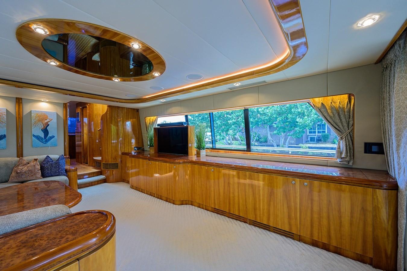 a large living room with a large mirror aboard 82 Yacht for Sale