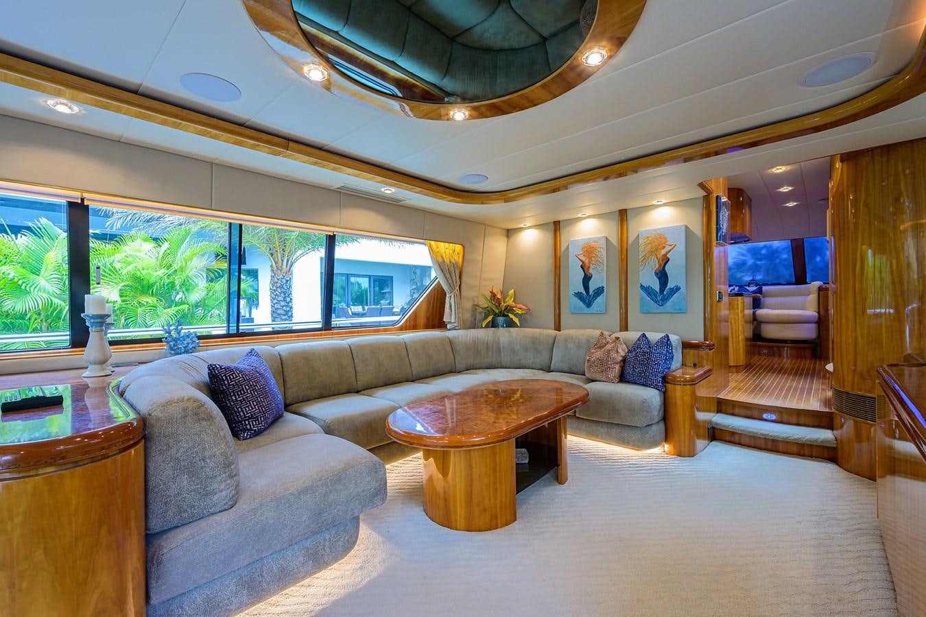 a living room with a large window aboard 82 Yacht for Sale