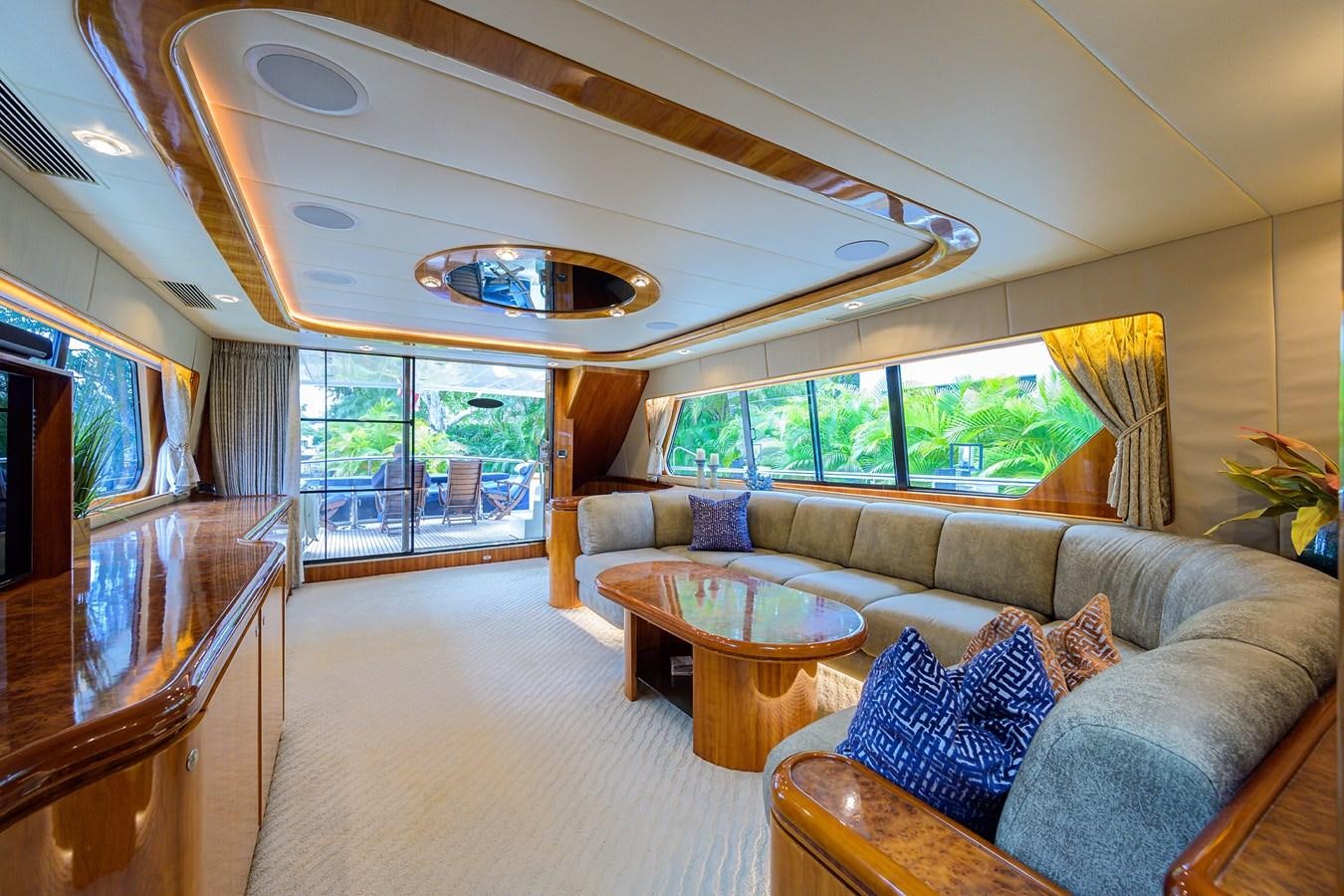 a living room with a large window aboard 82 Yacht for Sale