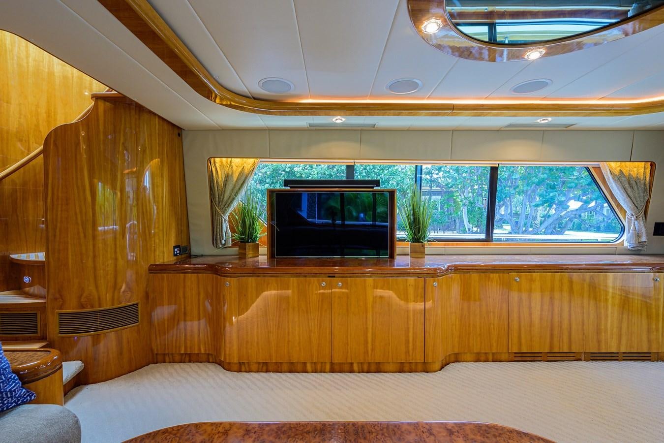 a room with a tv and a bed aboard 82 Yacht for Sale