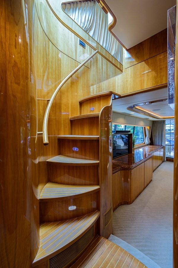 a wooden staircase with a wood railing aboard 82 Yacht for Sale