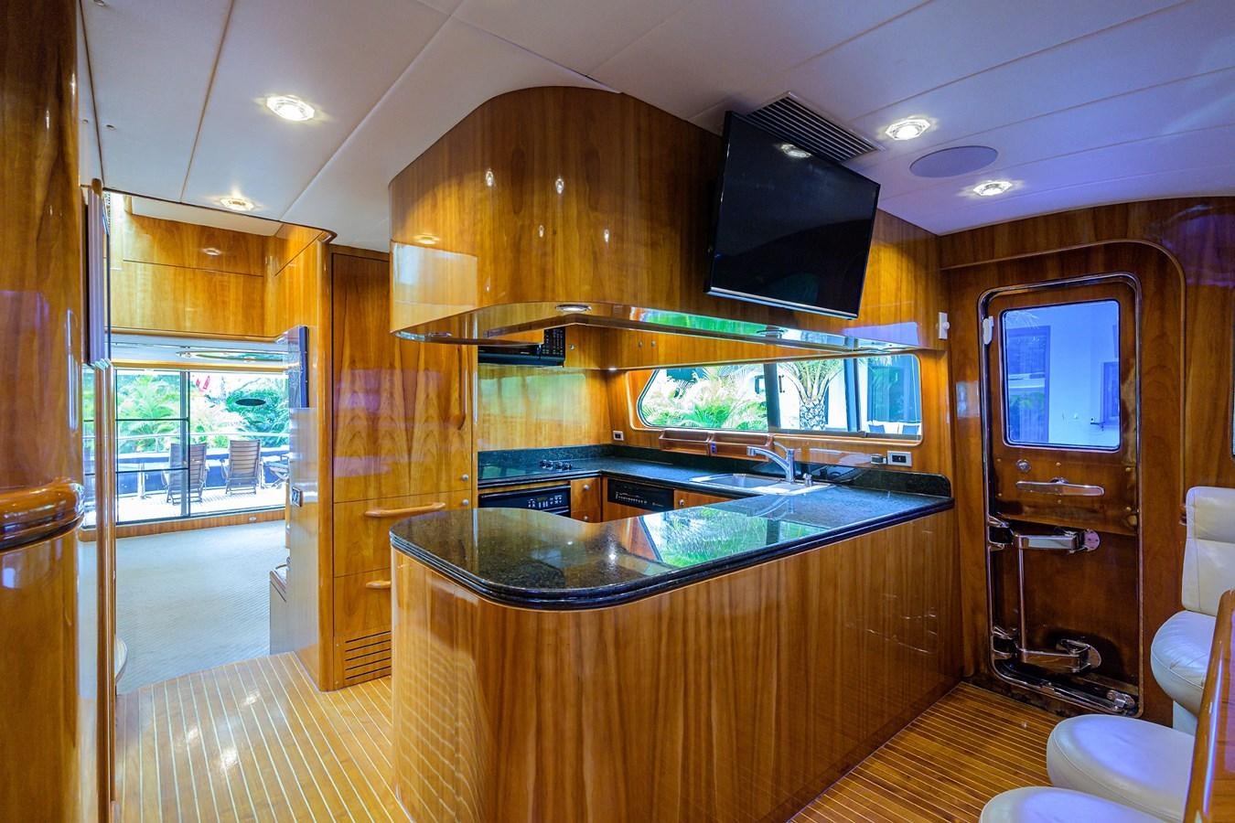 a kitchen with a large glass window aboard 82 Yacht for Sale