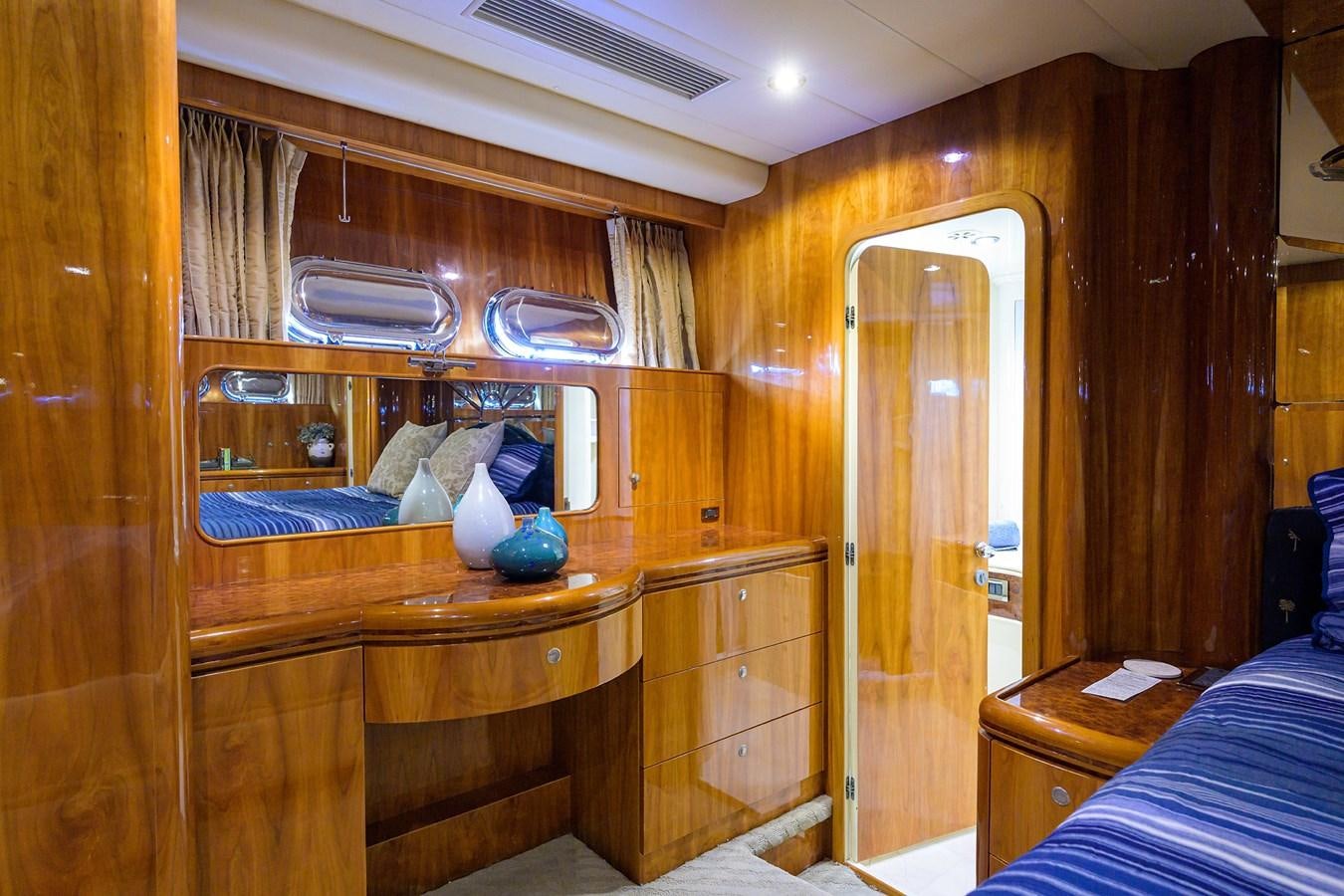 a room with a bed and a closet aboard 82 Yacht for Sale