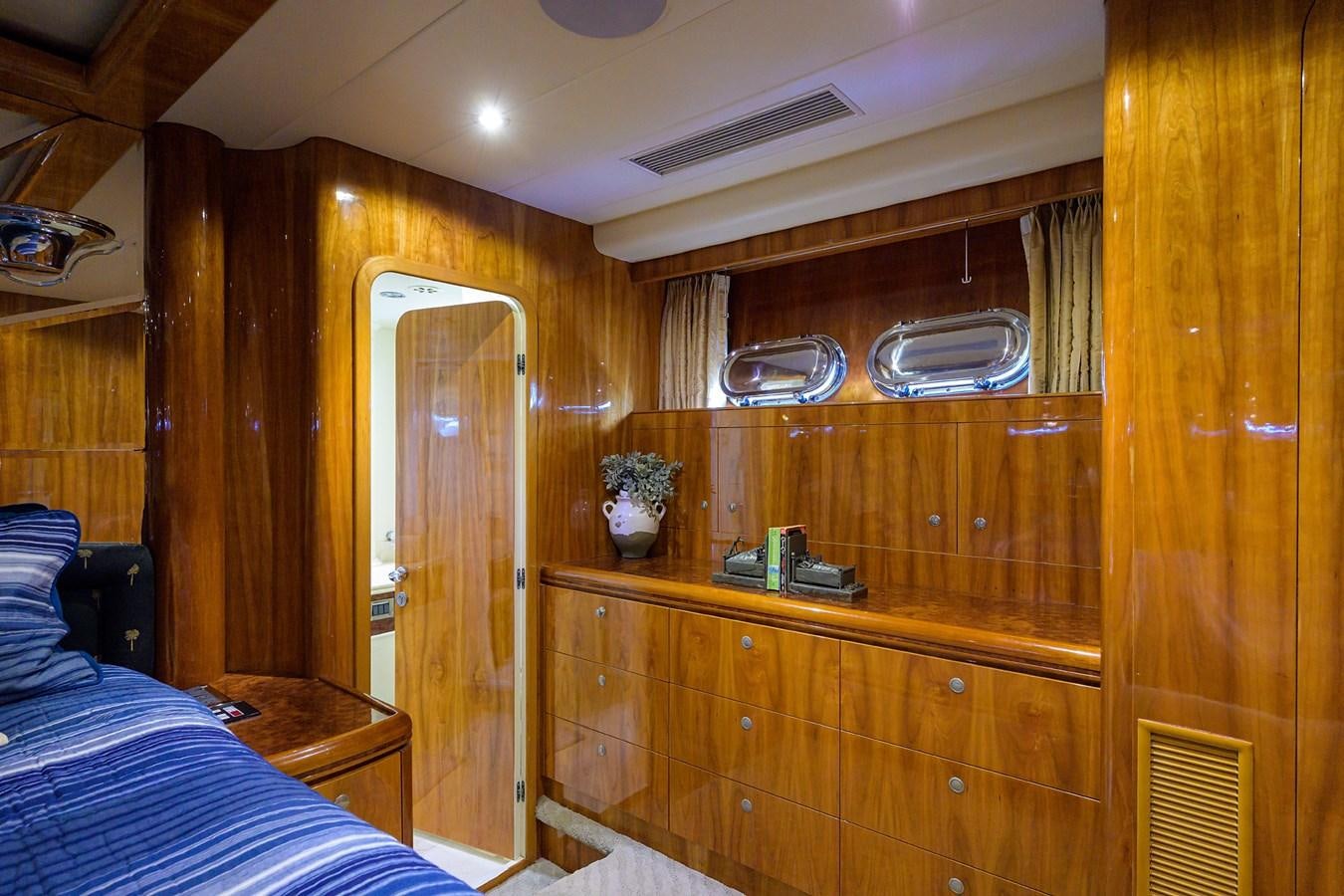 a room with wooden cabinets aboard 82 Yacht for Sale