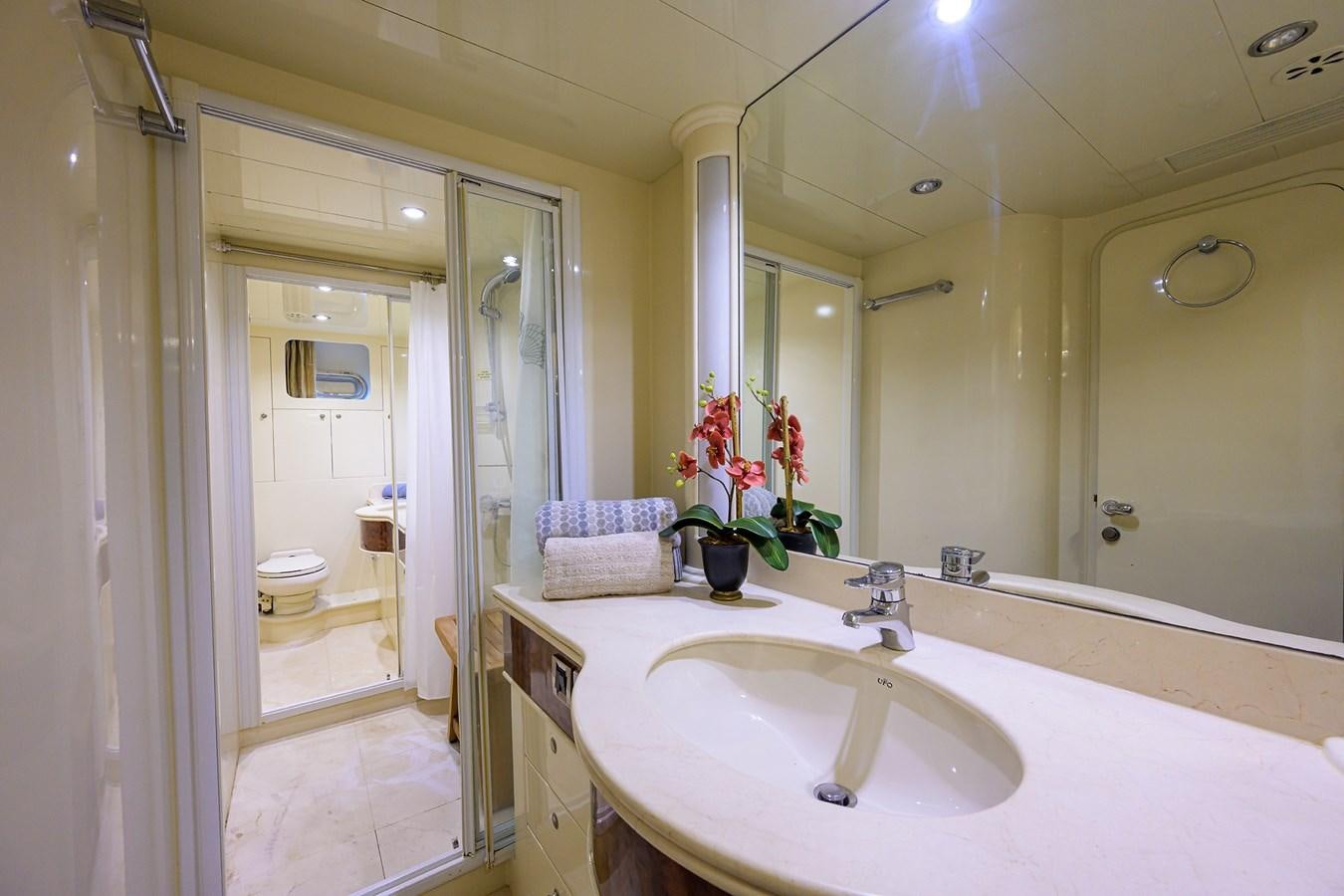 a bathroom with a large mirror aboard 82 Yacht for Sale