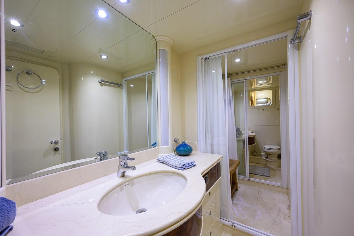 a bathroom with a large mirror aboard 82 Yacht for Sale