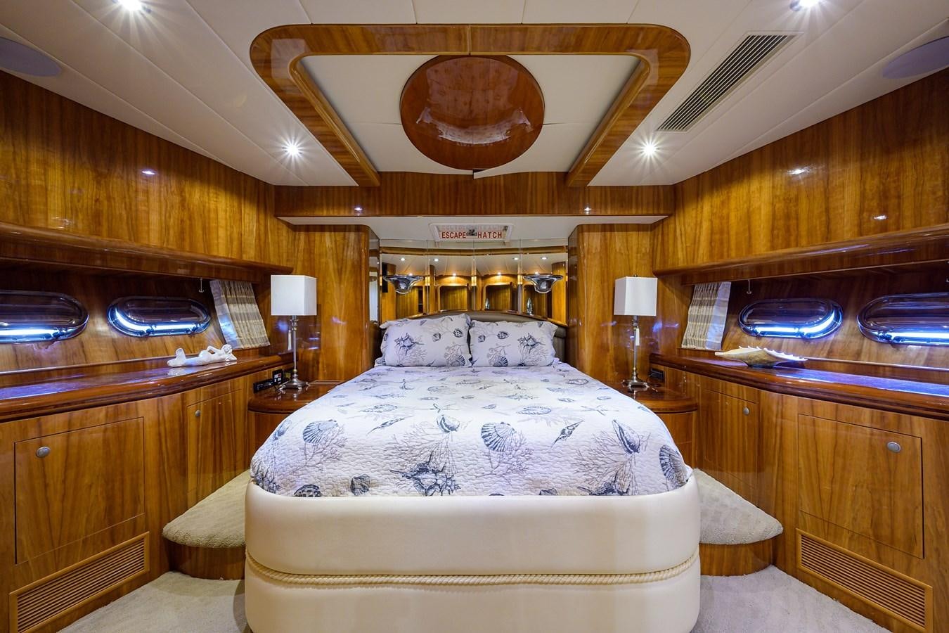 a room with a bed and a table aboard 82 Yacht for Sale