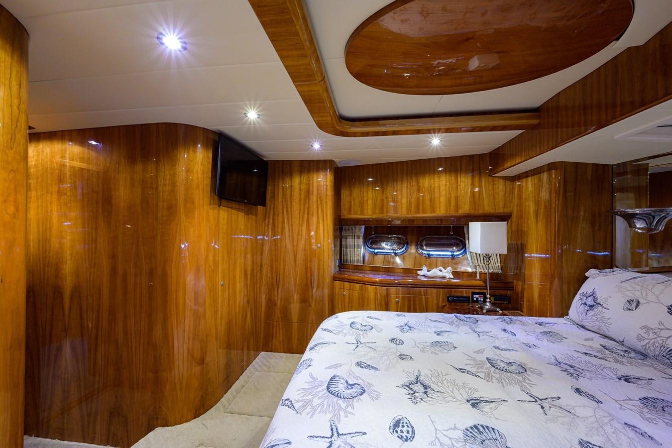 a bedroom with wood walls aboard 82 Yacht for Sale
