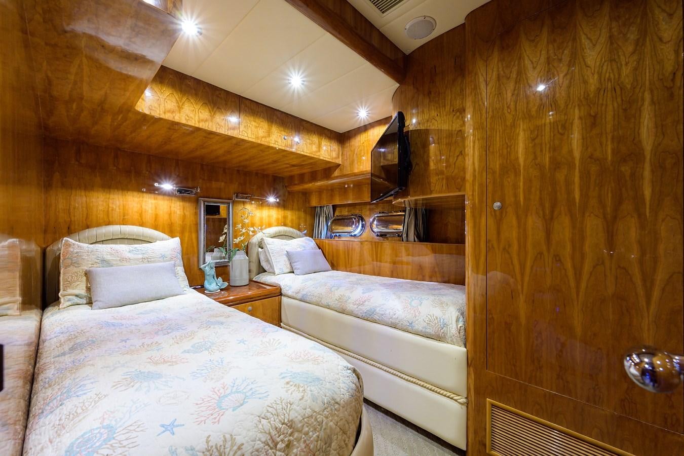 a room with two beds aboard 82 Yacht for Sale