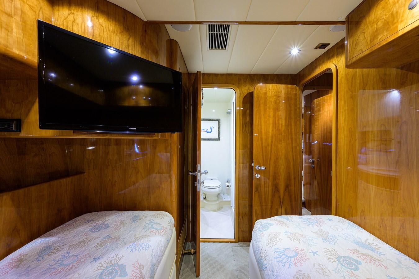 a room with a bed and a television aboard 82 Yacht for Sale